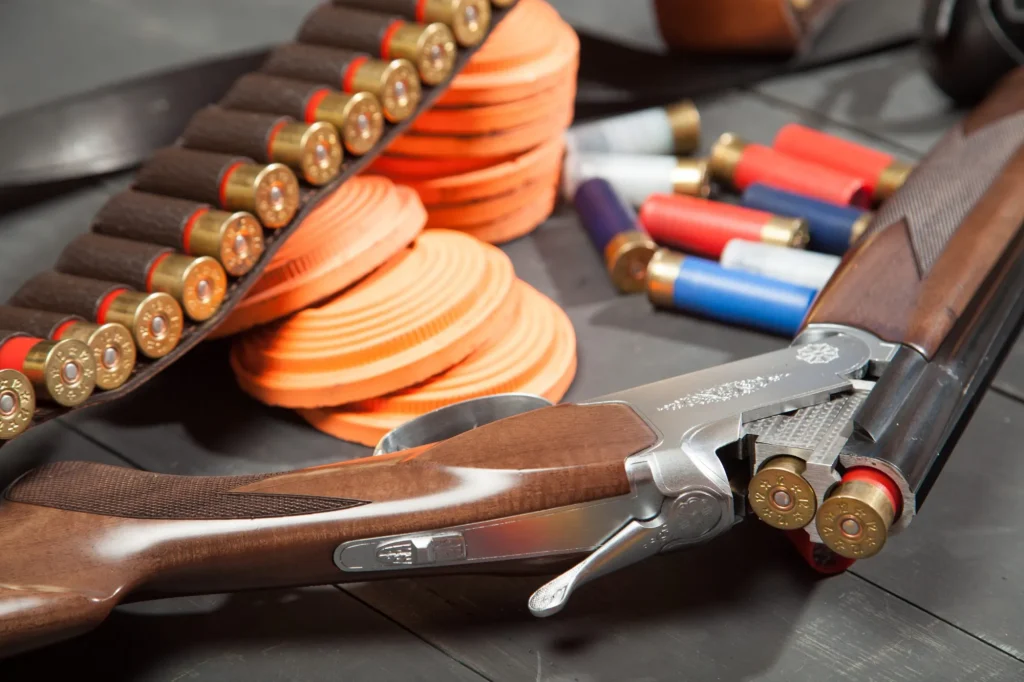 Sport shooting equipment on target. Air-gun and bullets.