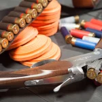 Sport shooting equipment on target. Air-gun and bullets.