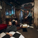 Couple trying to escape from burnt room with a ghost girl