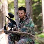 Players in paintball prepare for fight