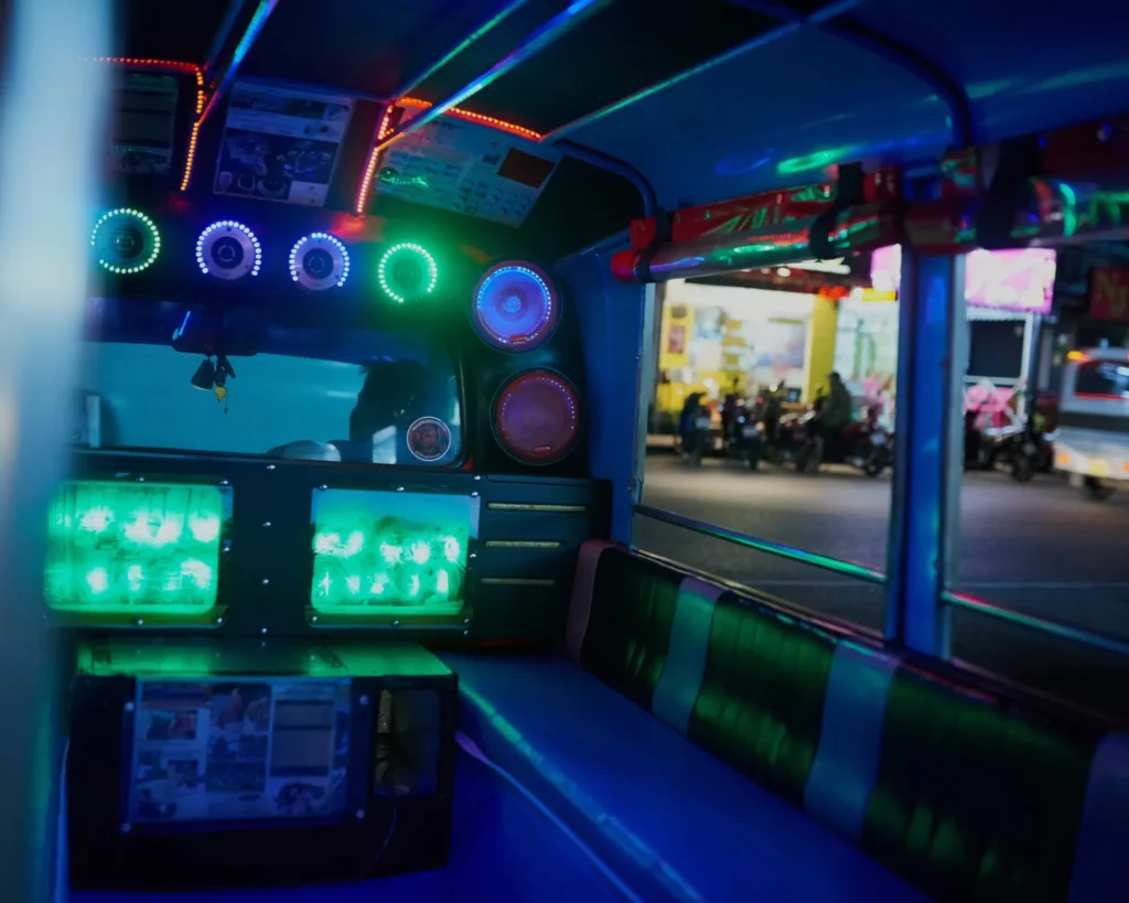 Lets take this party on the road. Shot of the inside of an empty party bus at night.