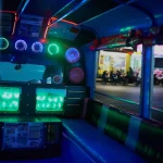 Lets take this party on the road. Shot of the inside of an empty party bus at night.