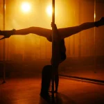 girl dancing striptease in a dark room with a red light