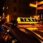 taxi sign on the roof of a taxi